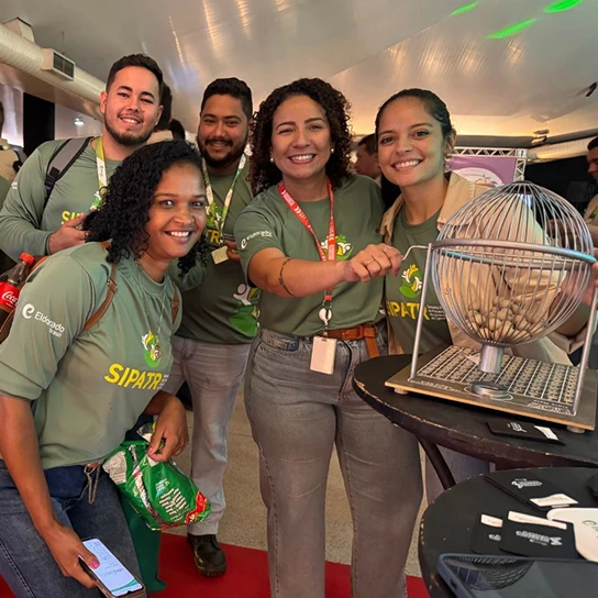 Employees smile as they watch the SIPAT Bingo raffle