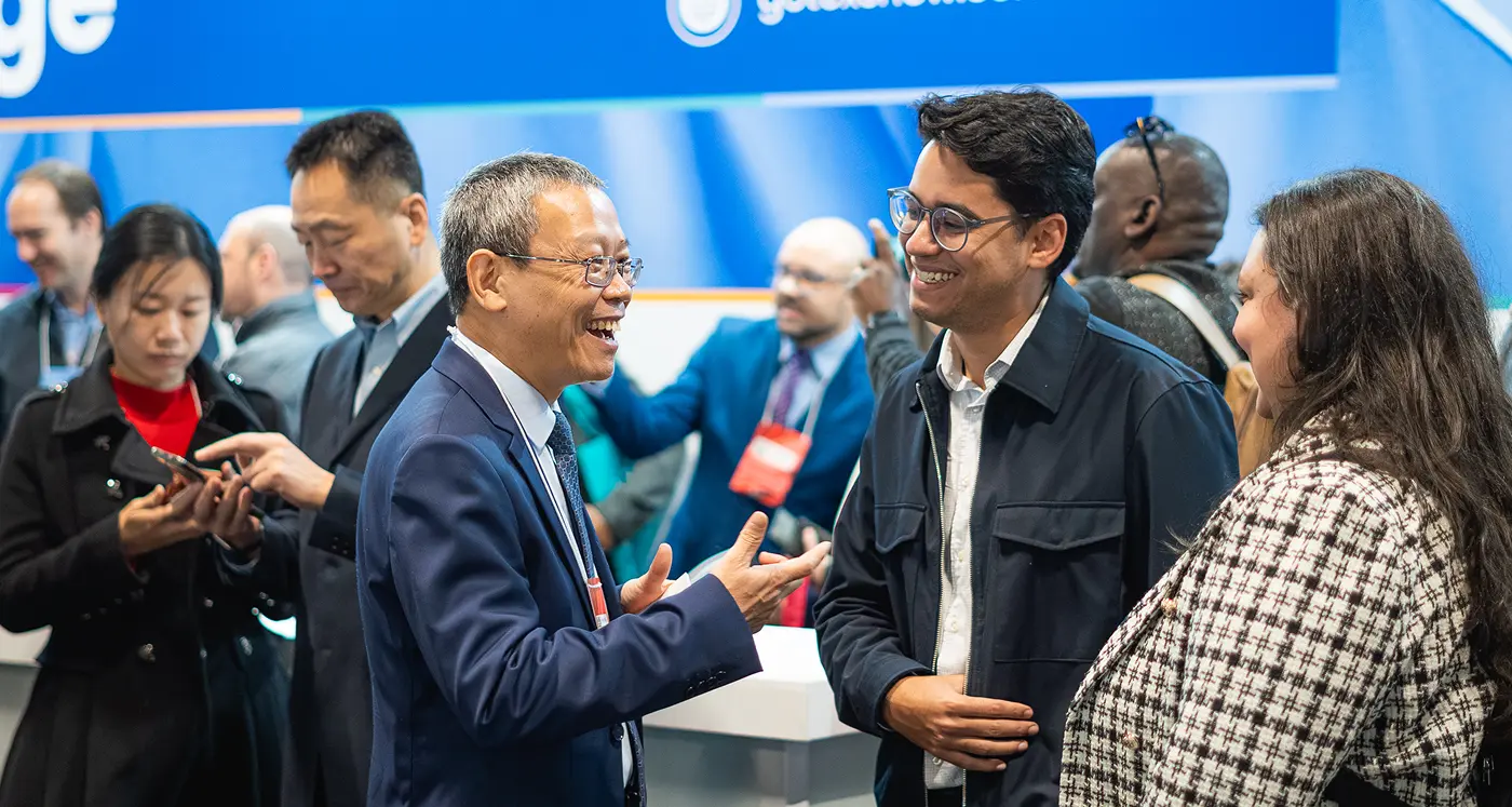 People talking in the Gotex Show Business Lounge