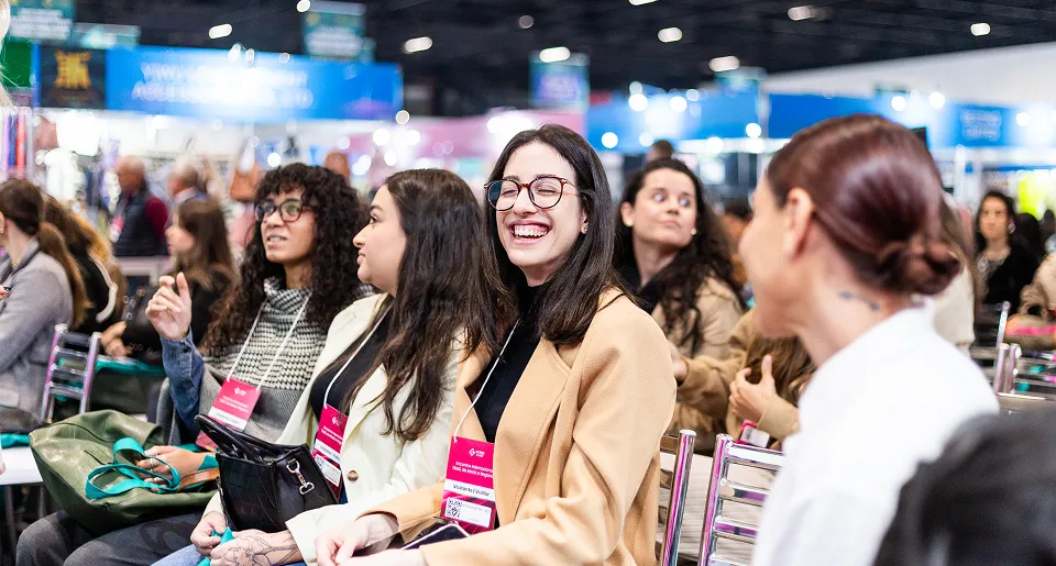 People smiling in the Gotex Show lecture area